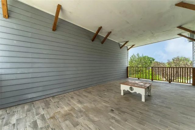 a view of a chairs in wooden deck