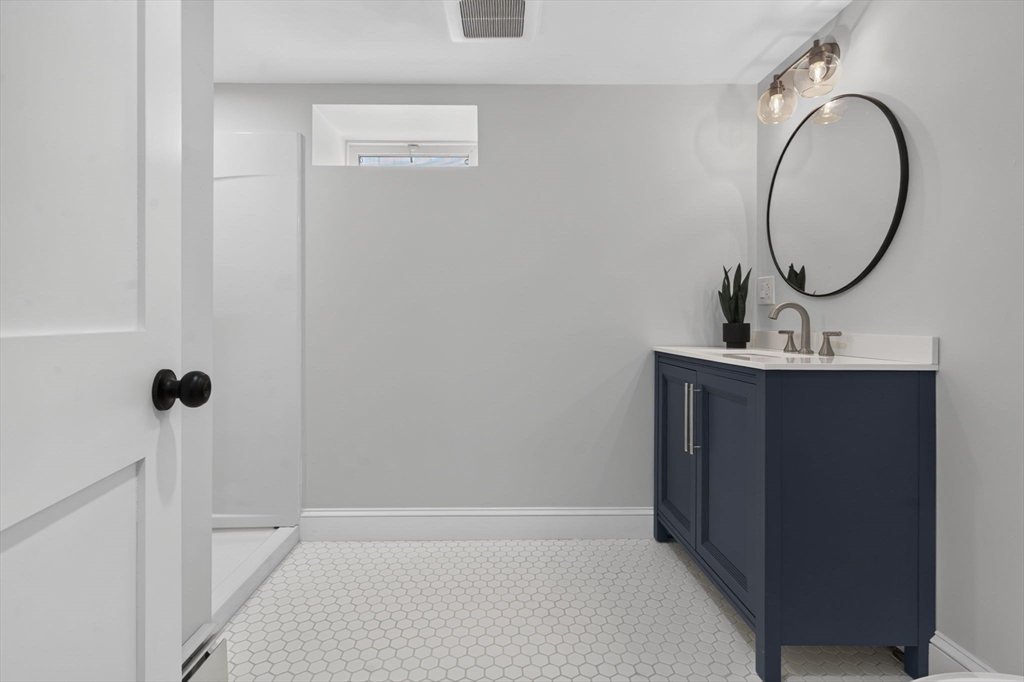 20 Saltonstall Road Medford, MA 02155 - Photo 38 of 41 a bathroom with a sink a vanity and a mirror
