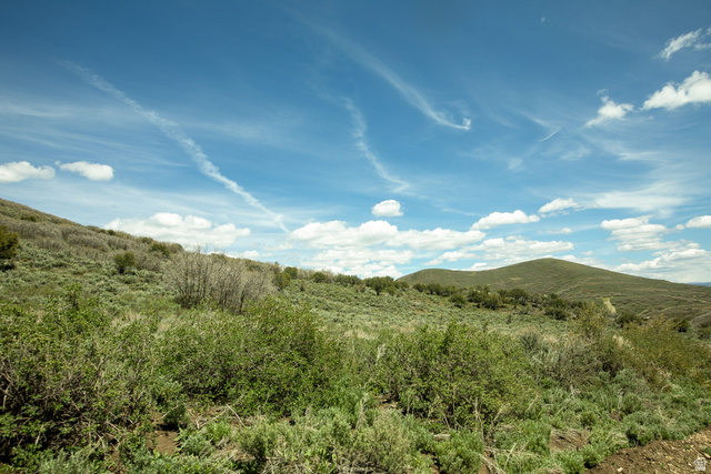1646 North Miles Holw Road, Unit 29 Kamas, UT 84036 - Photo 13 of 35 Expansive rolling hills featuring natural vegetation, a clear blue sky, and distant mountain ranges