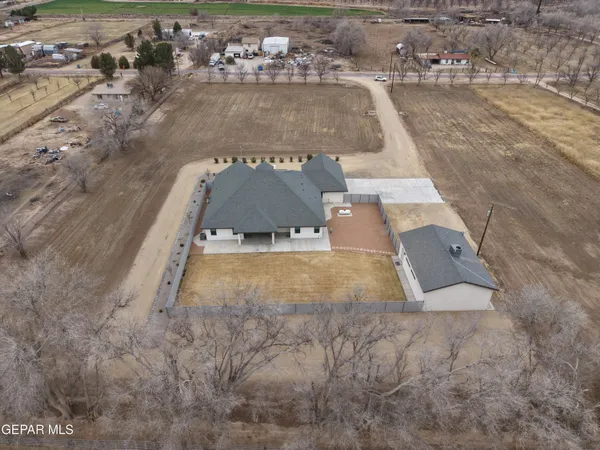 an empty room with a window and a ceiling fan