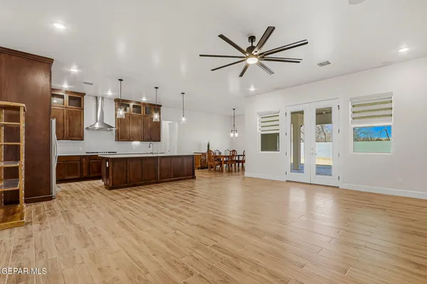 a view of workspace with wooden floor and a ceiling fan