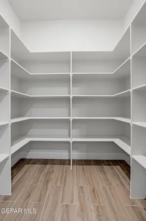 a living room with a bed furniture and a window