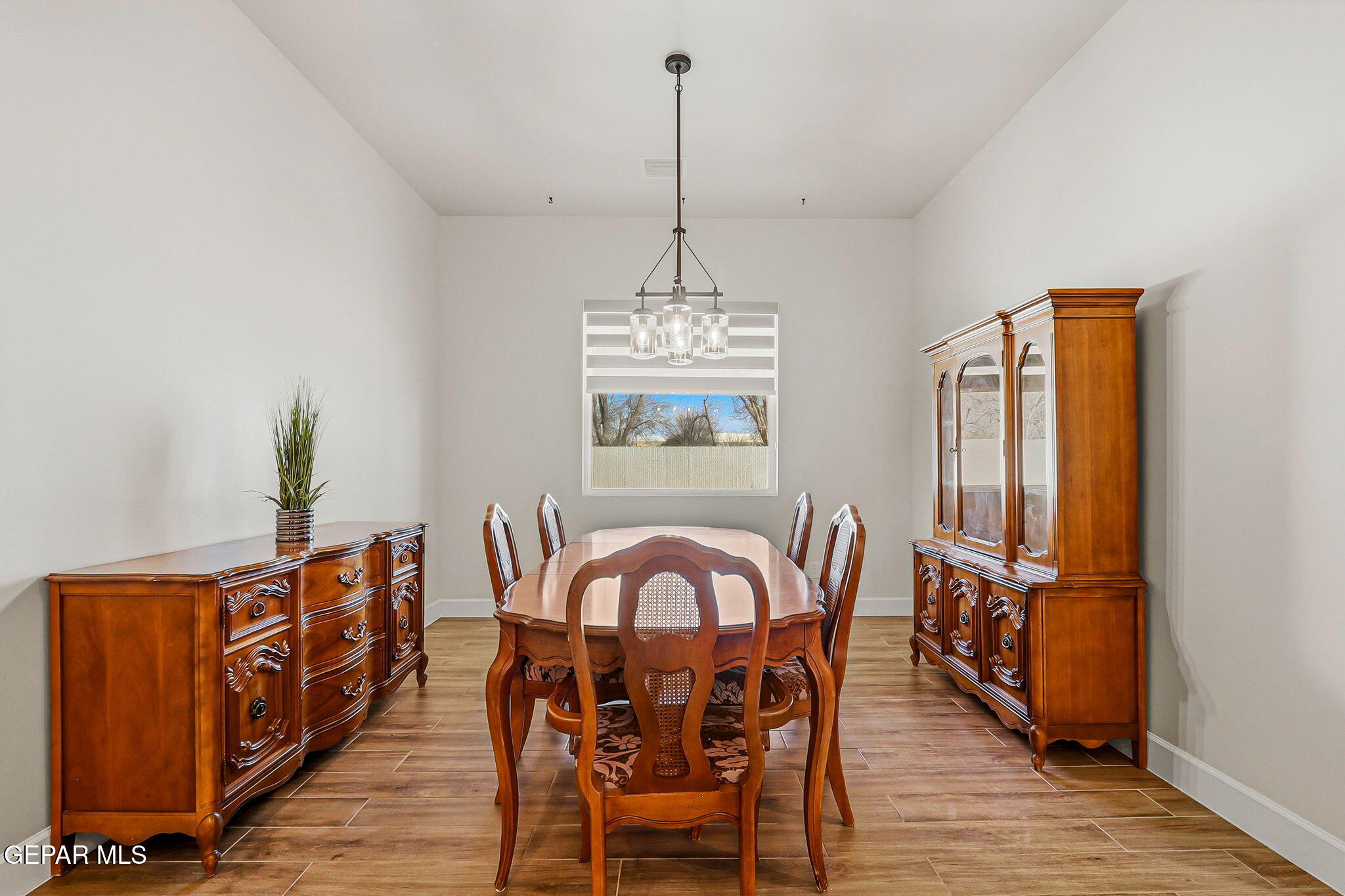 12329 Sugden Road Clint, TX 79836 - Photo 41 of 101 a view of a dining room with furniture window and wooden floor