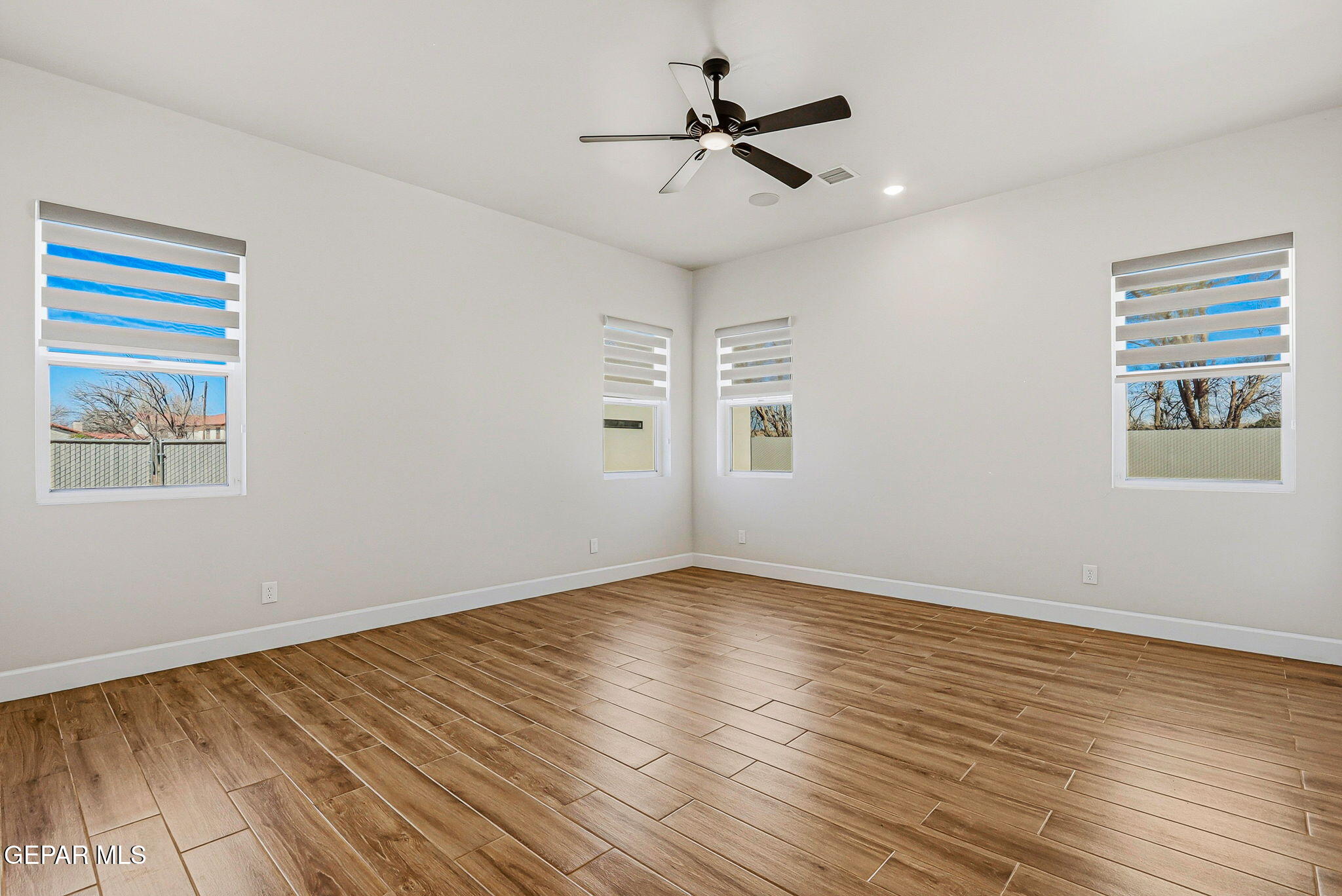 12329 Sugden Road Clint, TX 79836 - Photo 46 of 101 a view of empty room with wooden floor and fan