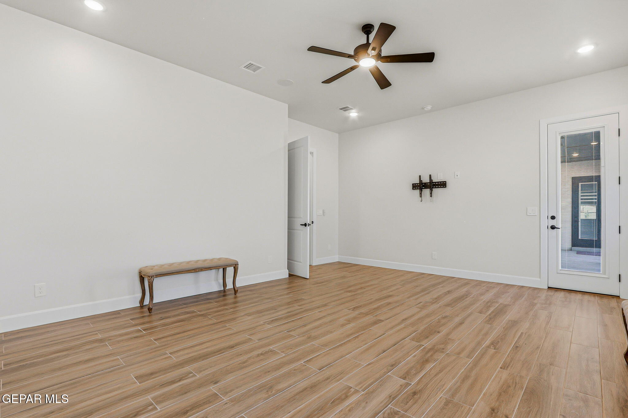 12329 Sugden Road Clint, TX 79836 - Photo 60 of 101 a view of room with hardwood floor and ceiling fan