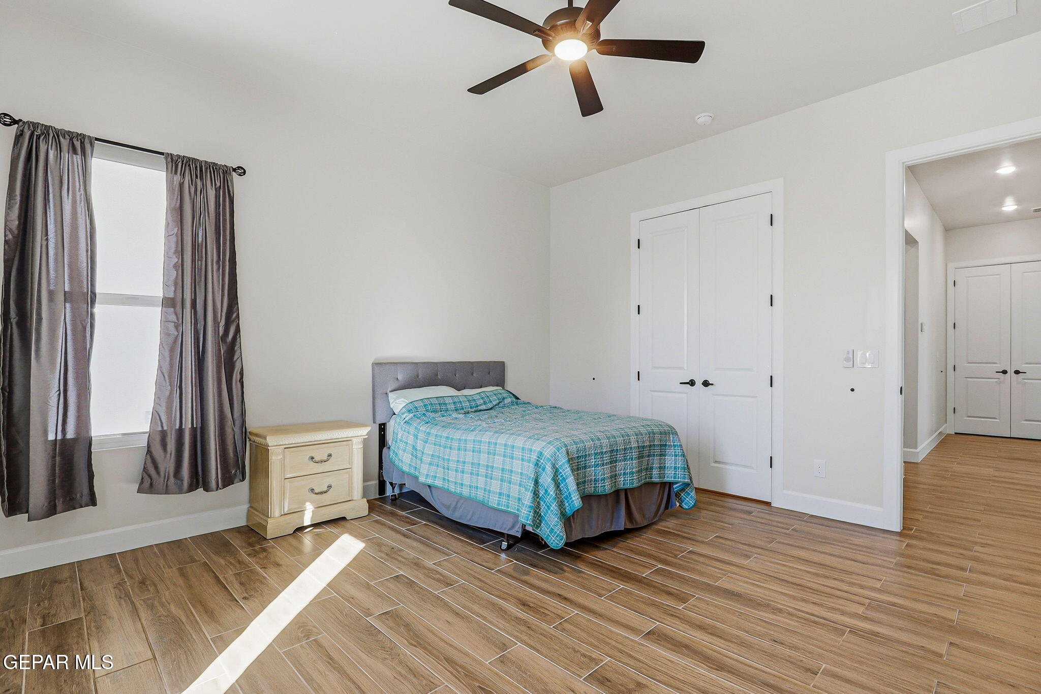 12329 Sugden Road Clint, TX 79836 - Photo 72 of 101 a living room with a bed furniture and a window