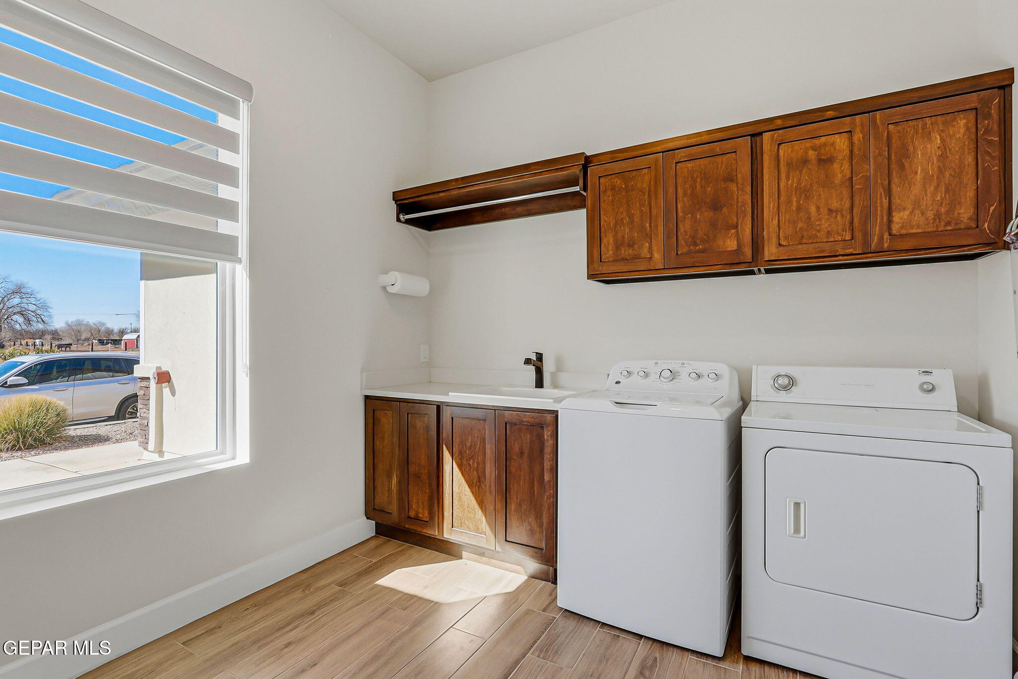 12329 Sugden Road Clint, TX 79836 - Photo 76 of 101 a view of storage and utility room with washer and dryer