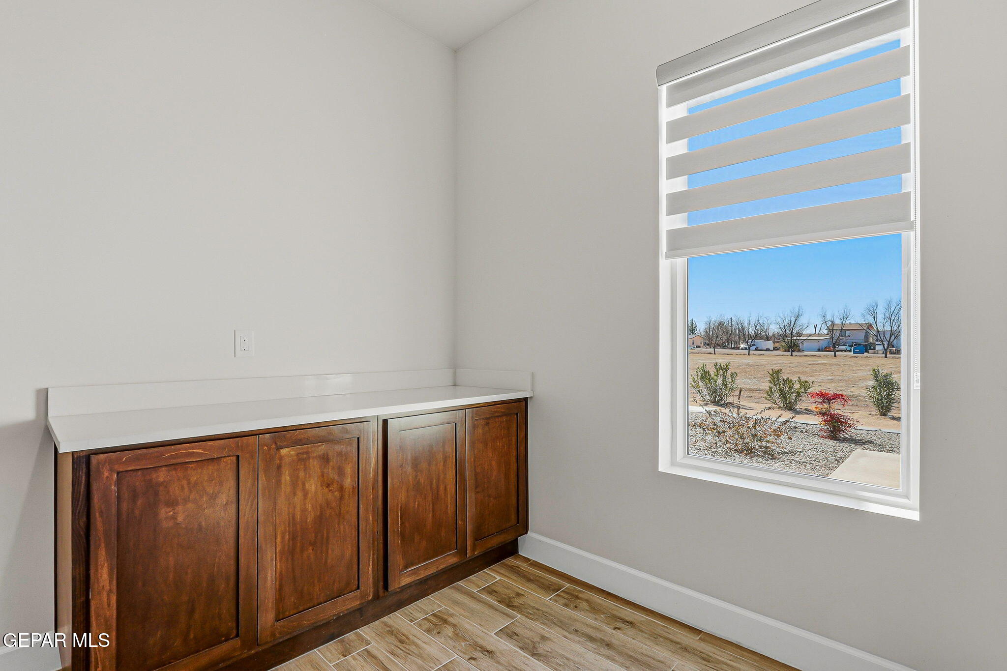 12329 Sugden Road Clint, TX 79836 - Photo 77 of 101 a view of an empty room with window and wooden floor