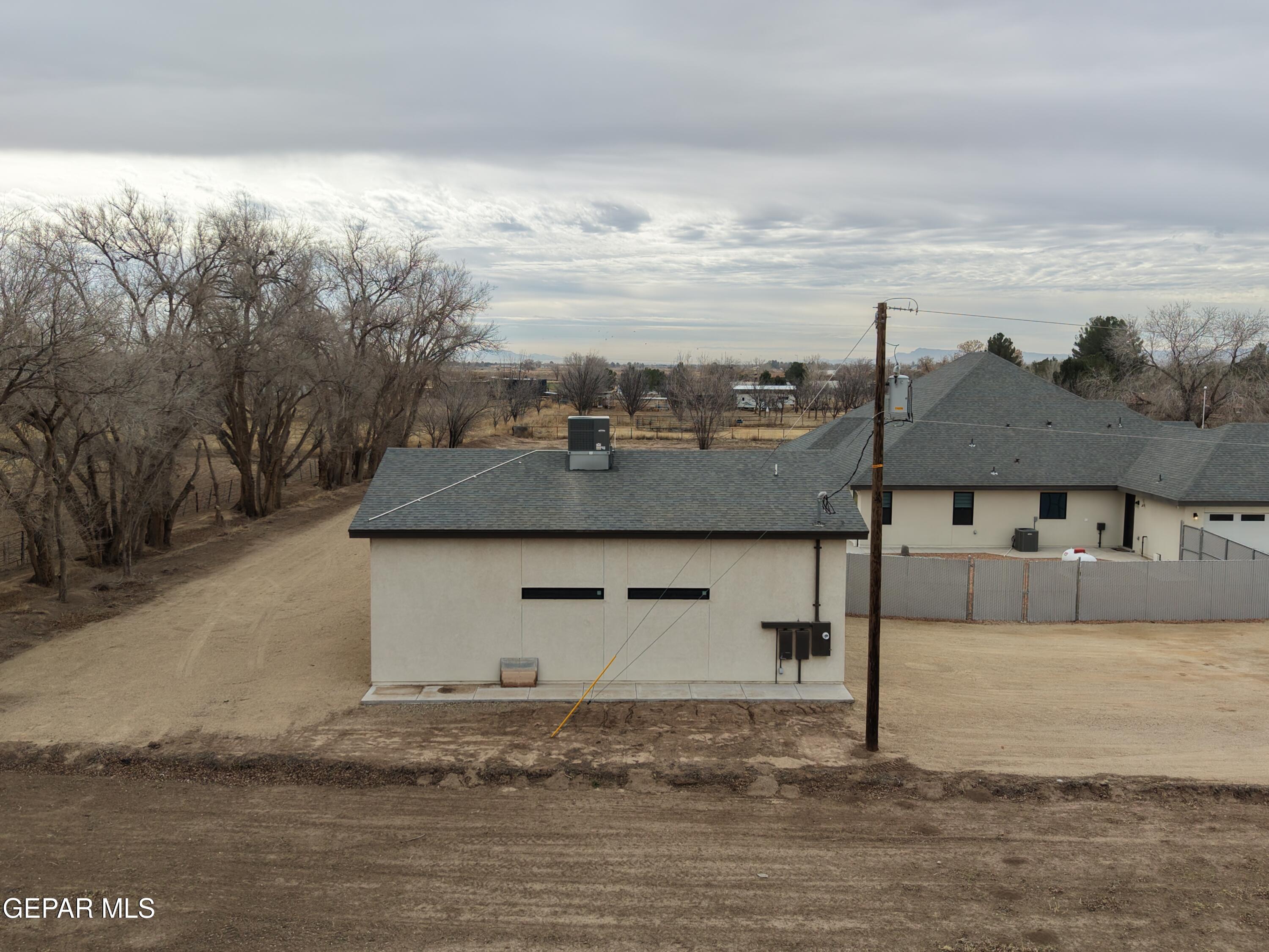 12329 Sugden Road Clint, TX 79836 - Photo 95 of 101 a front view of a house with a yard