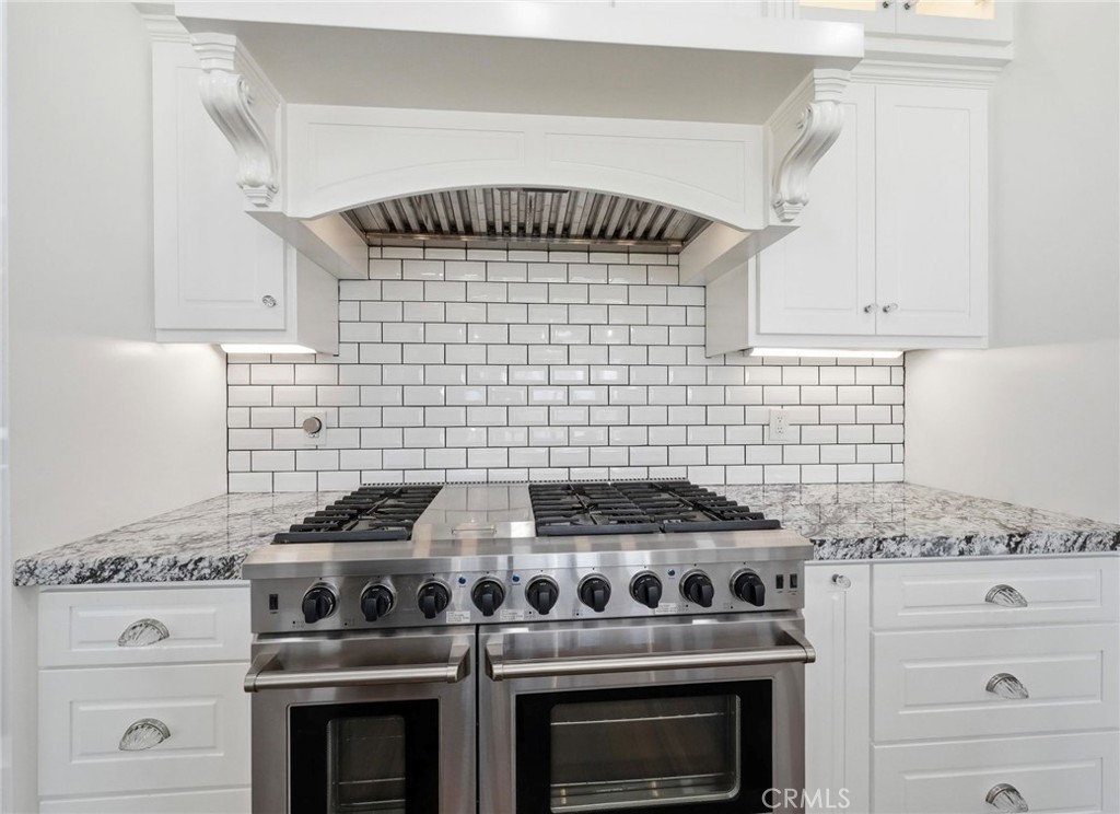 13925 Noble Way Red Bluff, CA 96080 - Photo 13 of 57 a stove top oven sitting inside of a kitchen