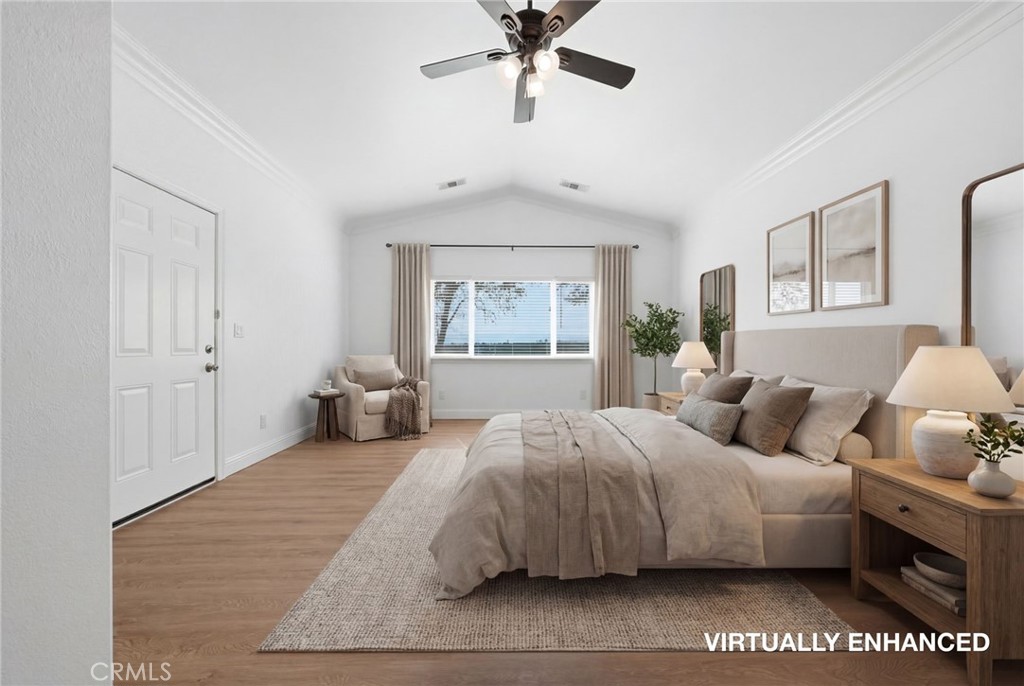 13925 Noble Way Red Bluff, CA 96080 - Photo 18 of 57 a bedroom with a large bed and a chandelier