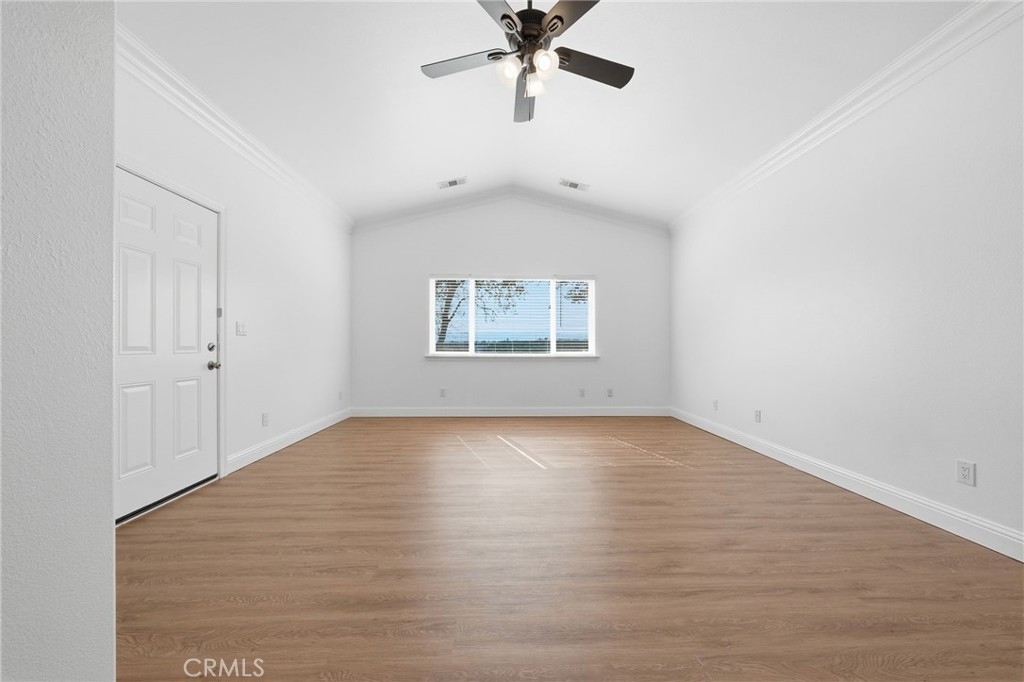 13925 Noble Way Red Bluff, CA 96080 - Photo 19 of 57 an empty room with fan and windows