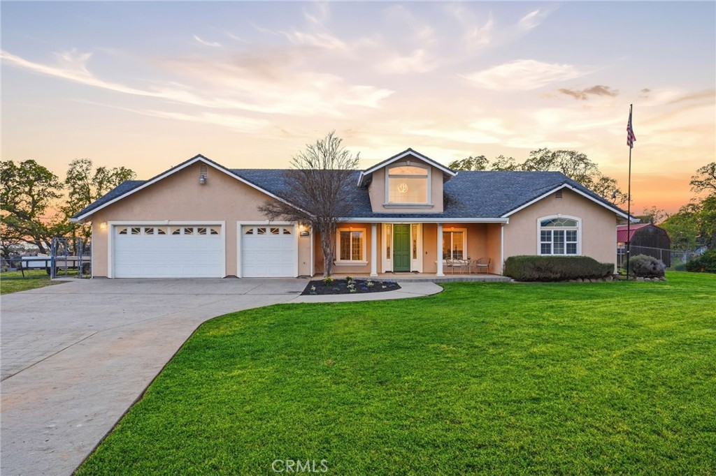 13925 Noble Way Red Bluff, CA 96080 - Photo 2 of 57 a view of a house with a yard and porch