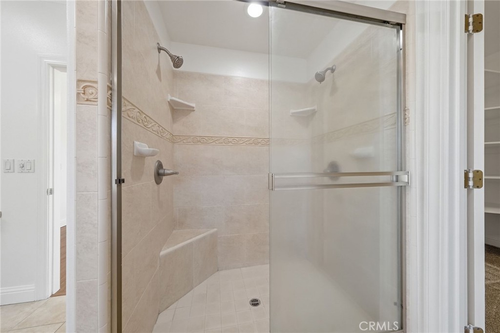 13925 Noble Way Red Bluff, CA 96080 - Photo 22 of 57 a bathroom with a glass shower door
