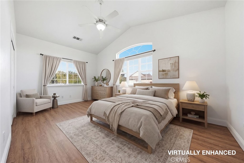 13925 Noble Way Red Bluff, CA 96080 - Photo 24 of 57 a spacious bedroom with a bed and a couch