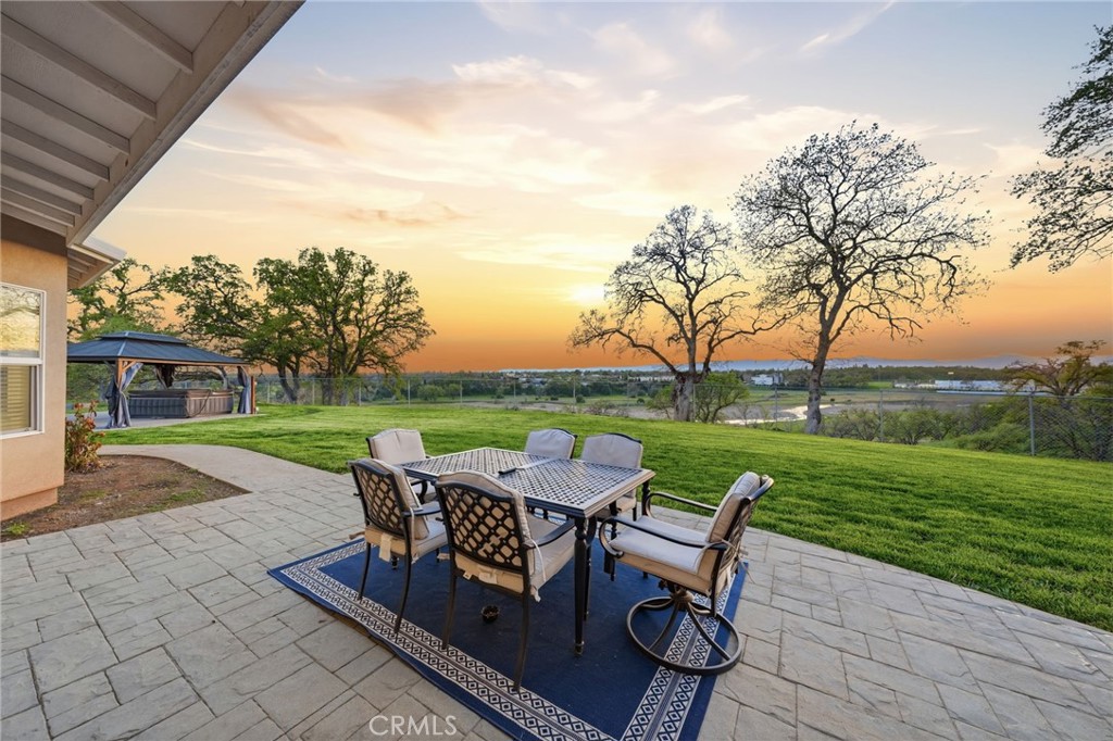 13925 Noble Way Red Bluff, CA 96080 - Photo 35 of 57 a view of a table and chairs in the garden