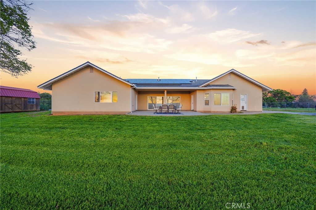 13925 Noble Way Red Bluff, CA 96080 - Photo 39 of 57 a view of a house with a big yard and large trees