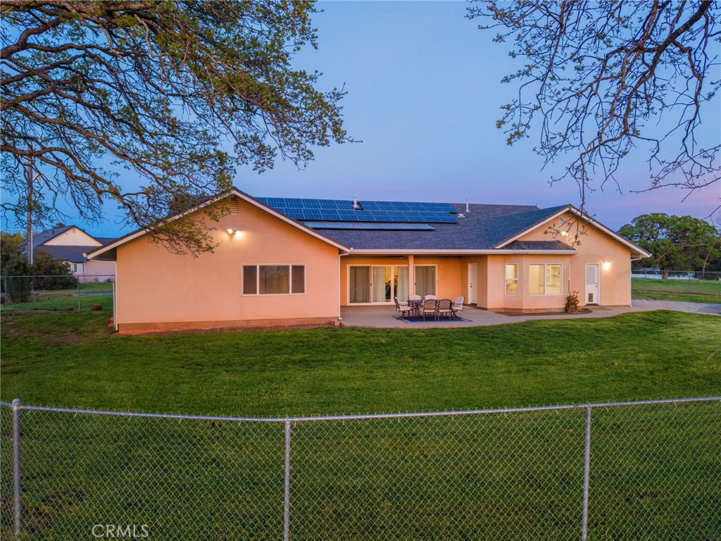 13925 Noble Way Red Bluff, CA 96080 - Photo 46 of 57 a house with green field in front of it