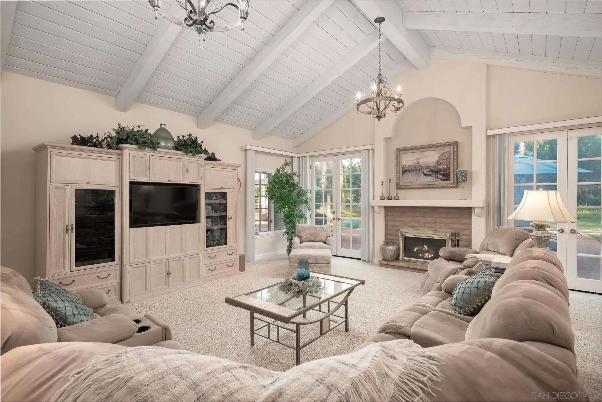 18221 Via Ascenso Rancho Santa Fe, CA 92067 - Photo 12 of 37 a living room with furniture a flat screen tv and a fireplace