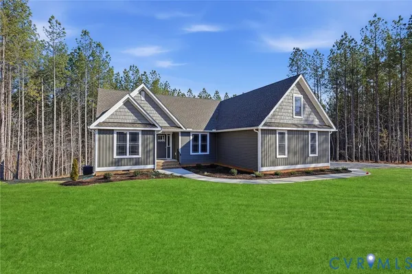 a front view of a house with a yard patio and swimming pool
