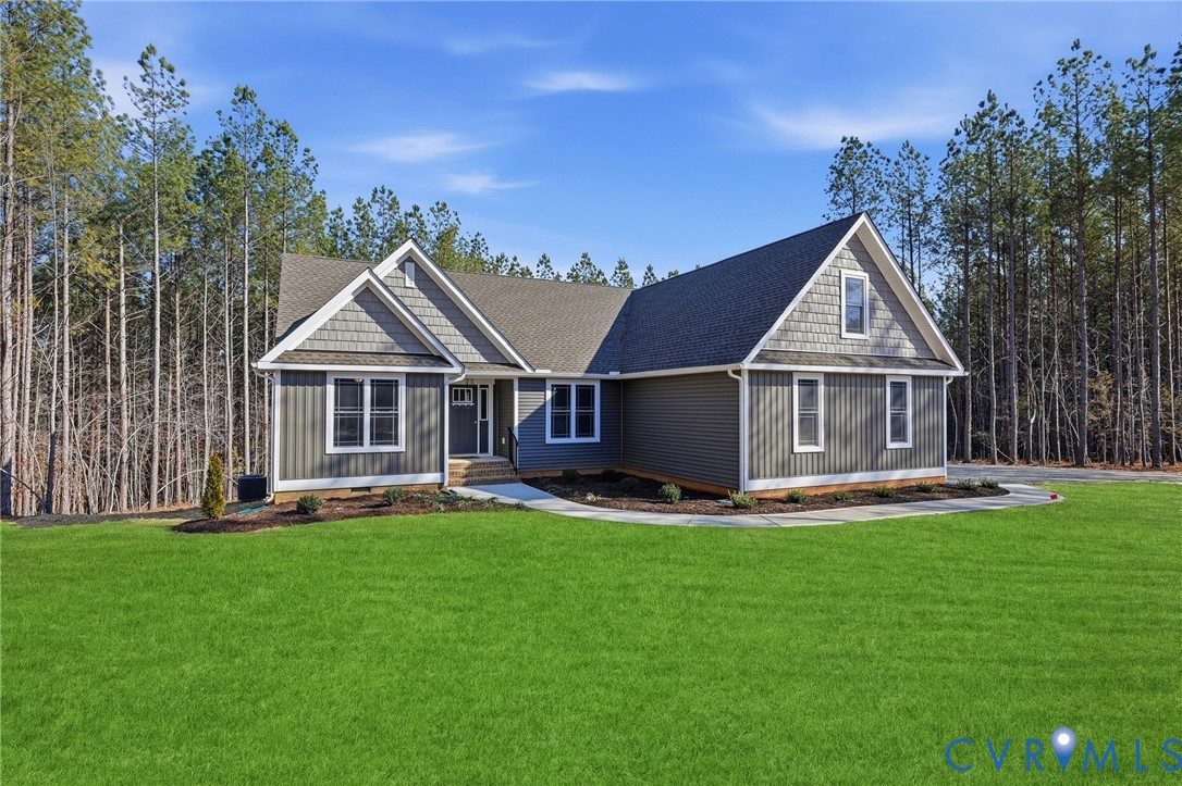 a front view of a house with a yard patio and swimming pool