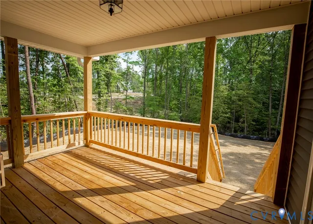 a view of a house with a backyard and floor to ceiling window
