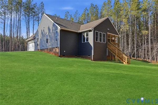a front view of house with yard and green space