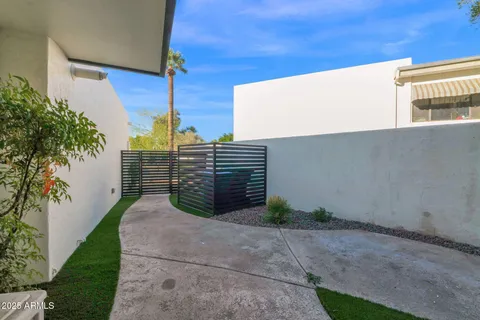 a view of a house with swimming pool and a yard