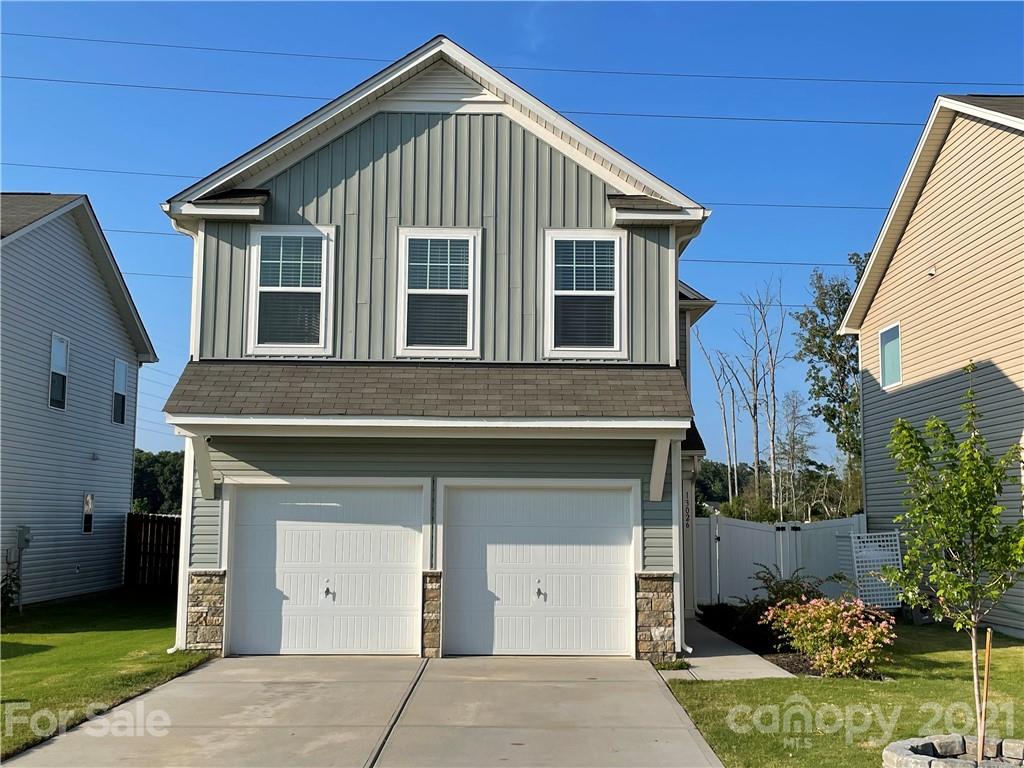 13026 Hill Pine Road, Unit 6 Midland, NC 28107 - Photo 1 of 37 a front view of a house with a yard