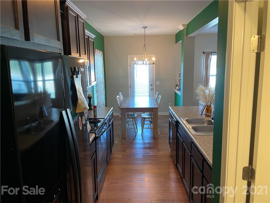 13026 Hill Pine Road, Unit 6 Midland, NC 28107 - Photo 11 of 37 a hallway with dining table and chairs