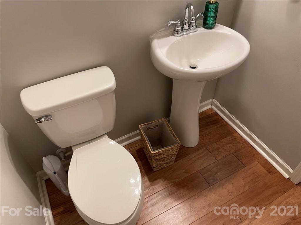 13026 Hill Pine Road, Unit 6 Midland, NC 28107 - Photo 13 of 37 a bathroom with a toilet sink and mirror