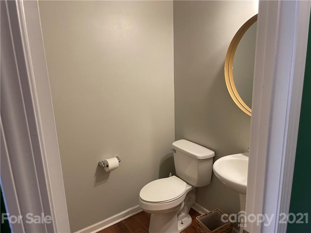 13026 Hill Pine Road, Unit 6 Midland, NC 28107 - Photo 14 of 37 a white toilet sitting next to a small bathroom