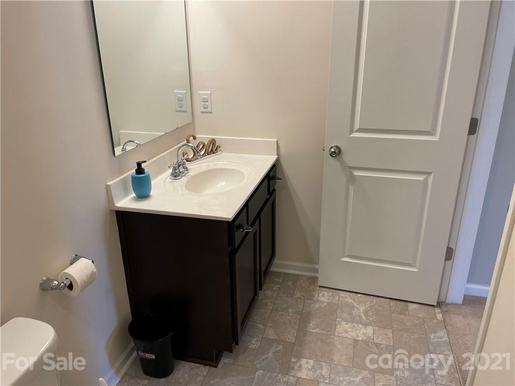 13026 Hill Pine Road, Unit 6 Midland, NC 28107 - Photo 21 of 37 a bathroom with a sink and a mirror