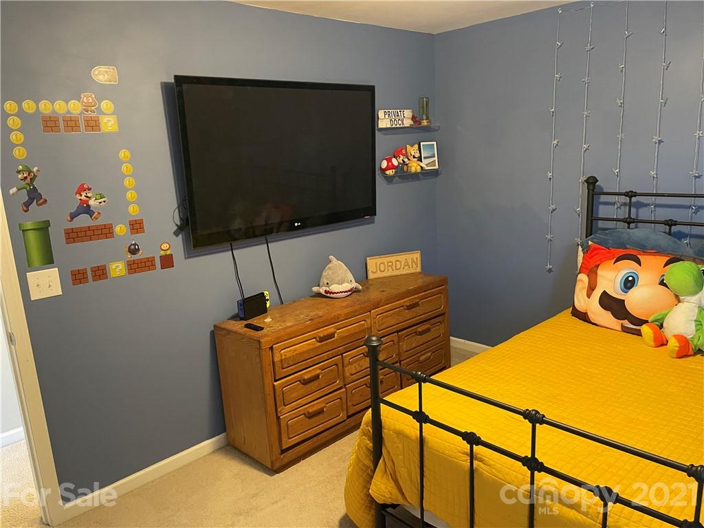 13026 Hill Pine Road, Unit 6 Midland, NC 28107 - Photo 24 of 37 a living room with furniture and a flat screen tv