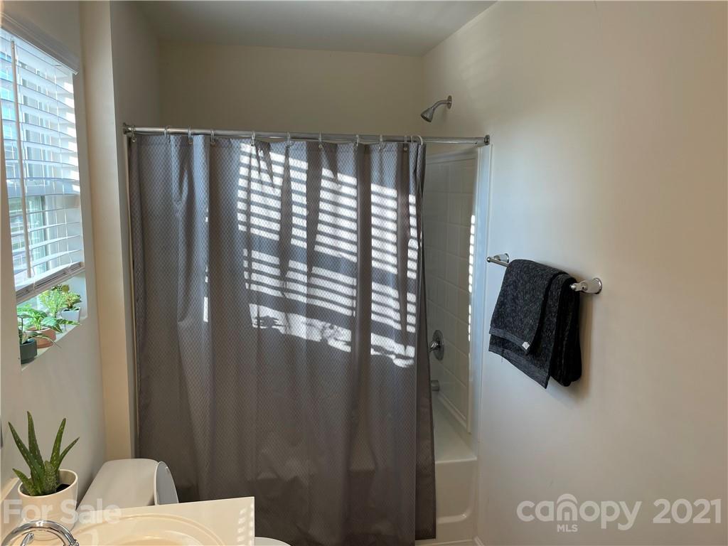 13026 Hill Pine Road, Unit 6 Midland, NC 28107 - Photo 31 of 37 a bathroom with a sink and mirror