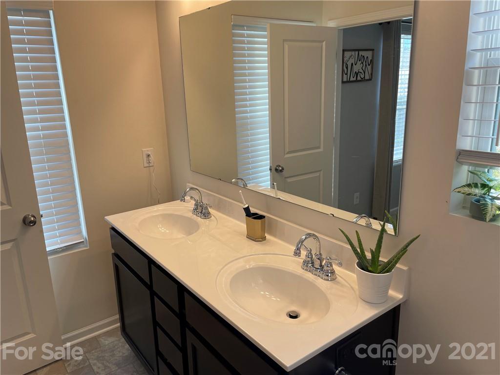 13026 Hill Pine Road, Unit 6 Midland, NC 28107 - Photo 32 of 37 a bathroom with a sink and a mirror