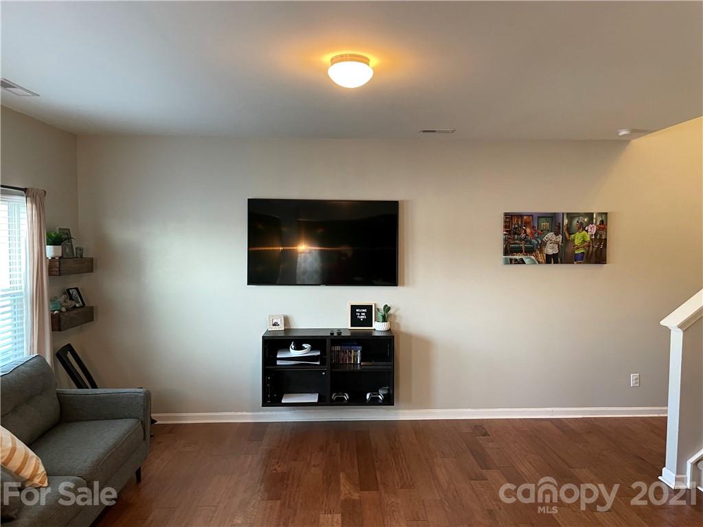 13026 Hill Pine Road, Unit 6 Midland, NC 28107 - Photo 6 of 37 a living room with furniture and a flat screen tv