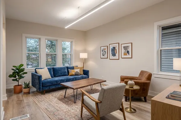 a living room with furniture and a large window
