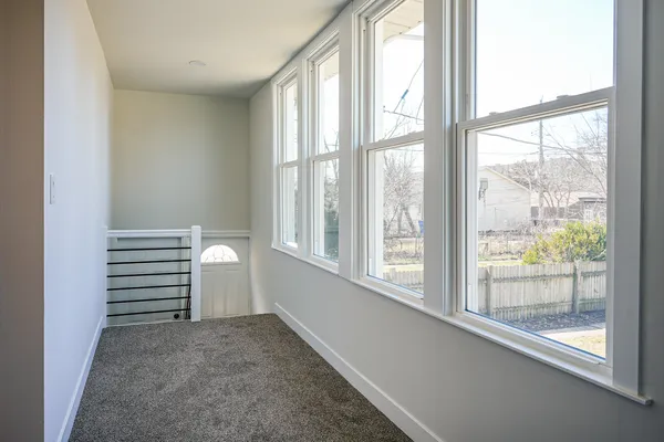 a view of a room that has a window in it