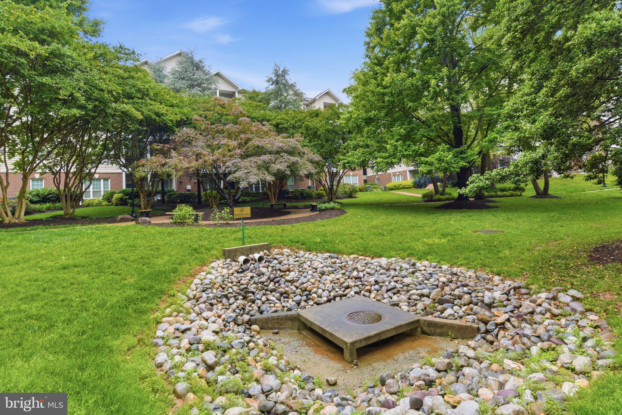 1580 Spring Gate Dr., Unit 4303 McLean, VA 22102 - Photo 33 of 41 Serene garden oasis with lush greenery.