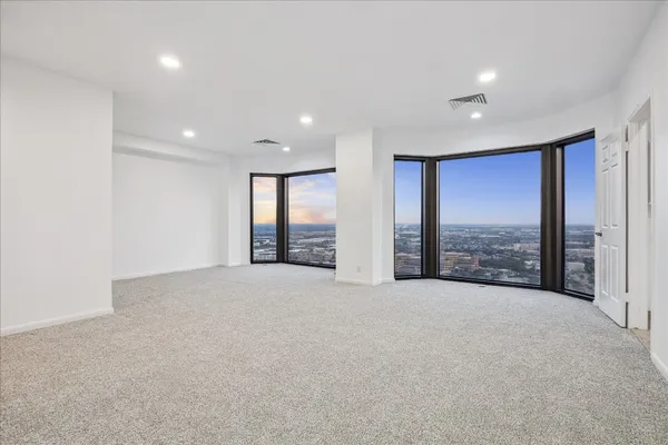 a view of an empty room with a balcony
