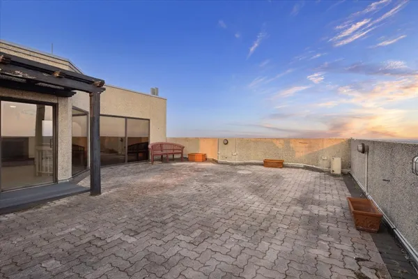 a view of backyard with seating space