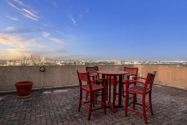 a view of a terrace with furniture and stove