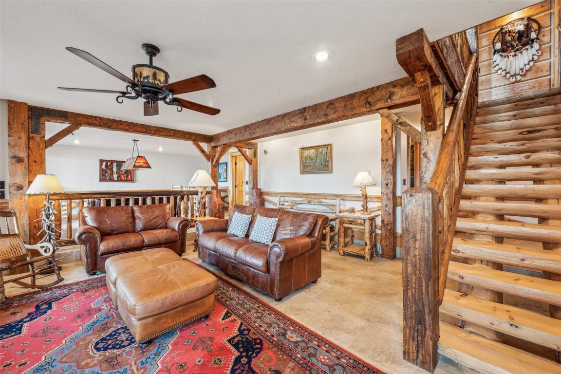 733 Spring Creek Ranch Road Silverthorne, CO 80498 - Photo 13 of 37 a living room with furniture and a rug