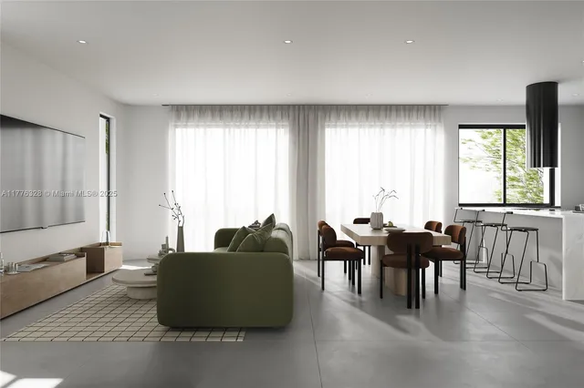 a living room with furniture and large windows