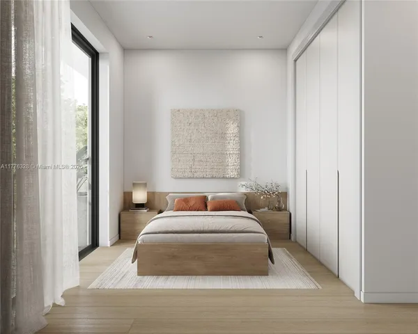 a bedroom with a large bed and a window