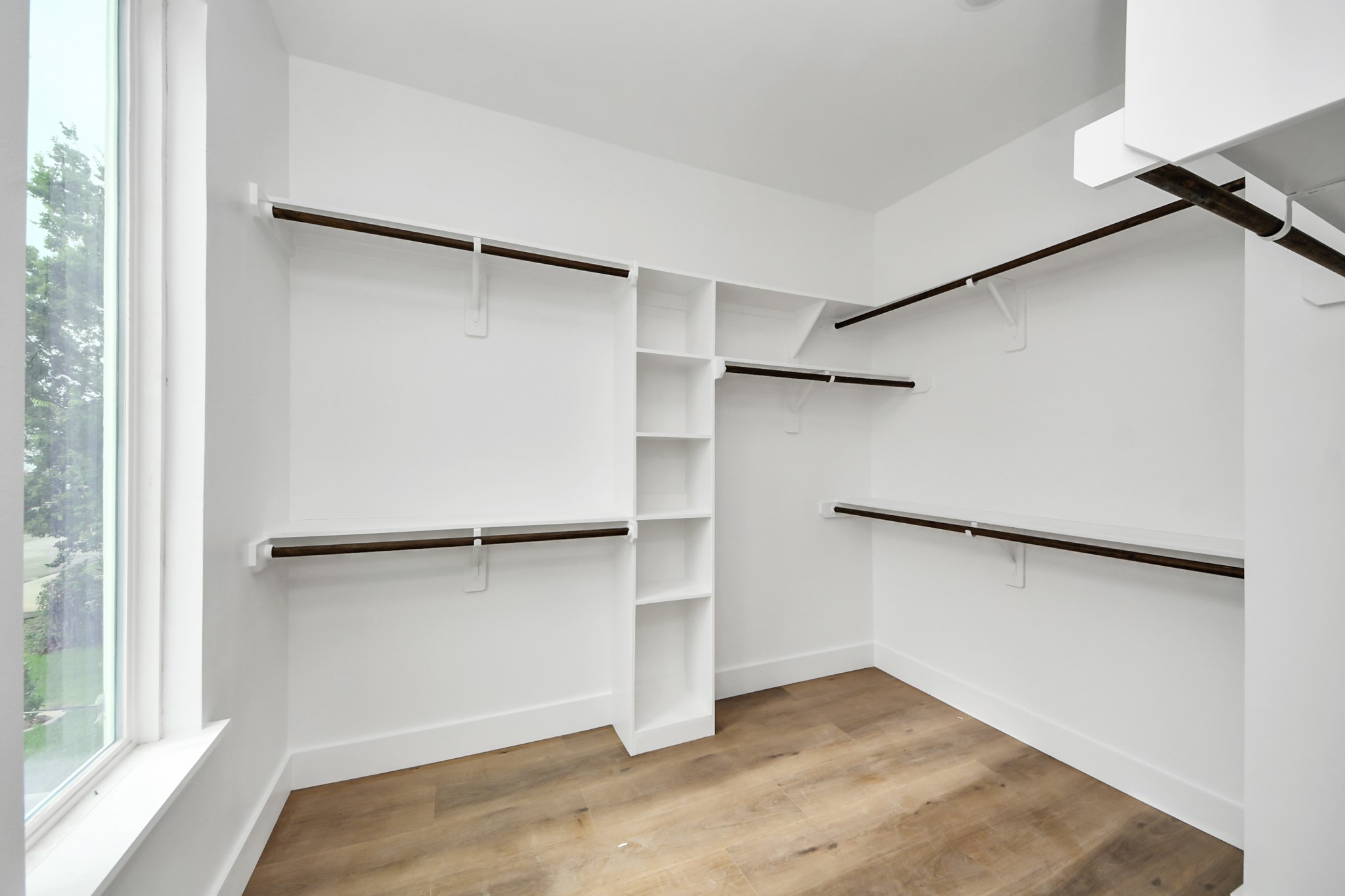 8206 Colonial Lane Houston, TX 77051 - Photo 26 of 31 a view of walk in closet with empty racks