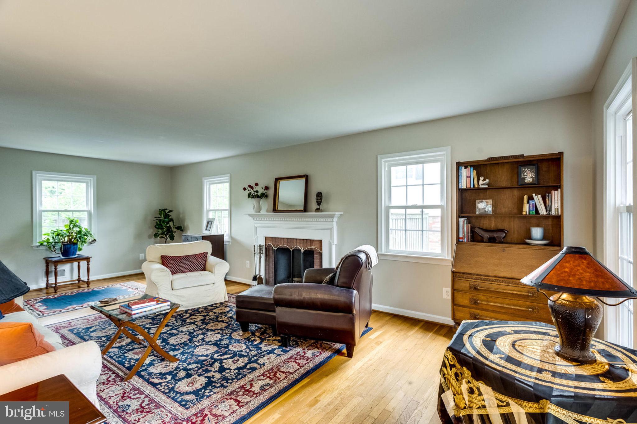 7700 Hayfield Road Alexandria, VA 22315 - Photo 7 of 58 Living room with wood burning fireplace