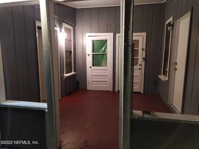 a white toilet sitting next to a bath tub