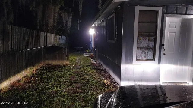 a view of an empty room with a fireplace